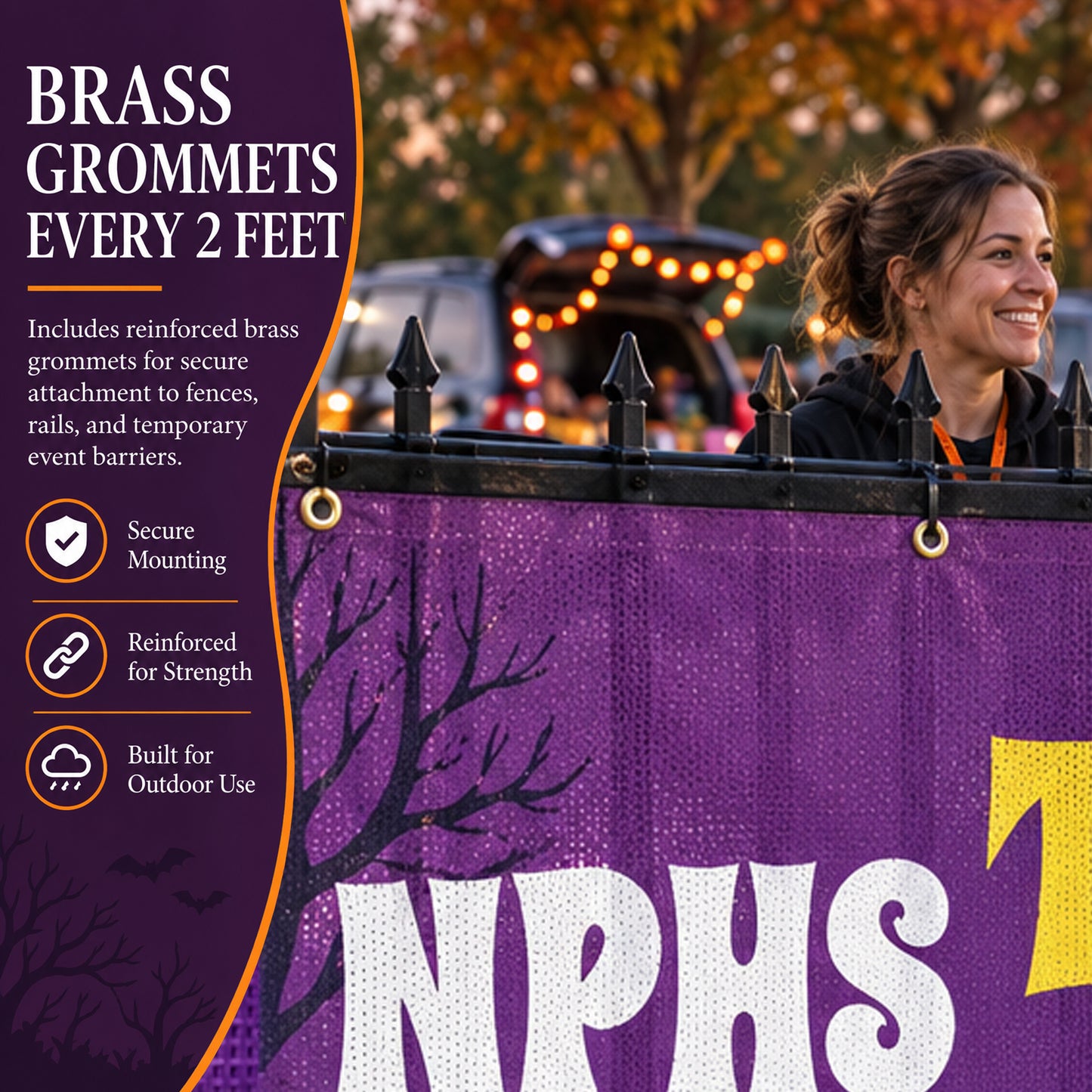 Purple outdoor banner with large white and yellow lettering, shown hanging over a black fence at dusk. A smiling woman is partially visible behind the fence on the right, and the left side contains product feature text about brass grommets every 2 feet.
