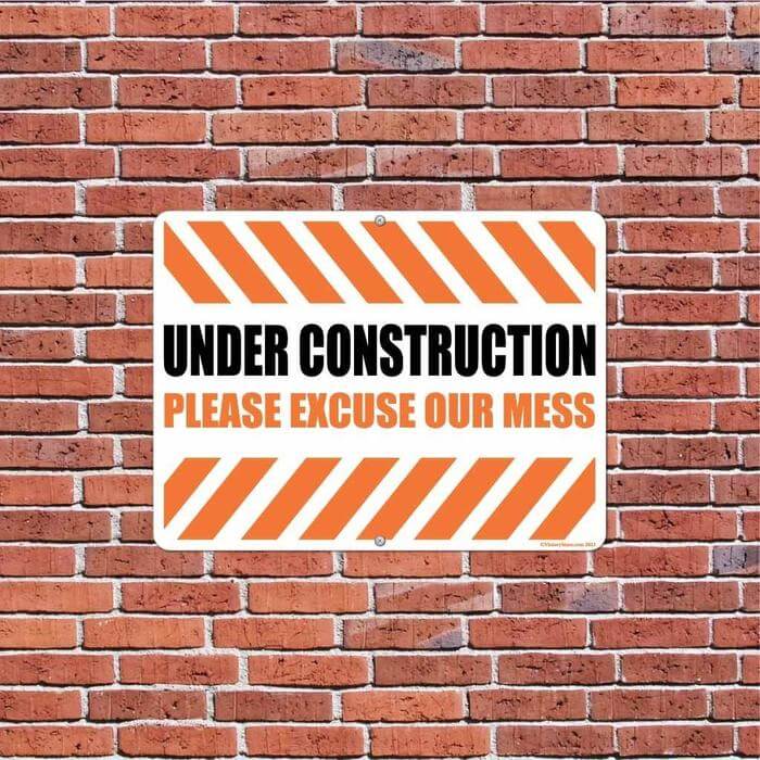 under construction please excuse our mess sign